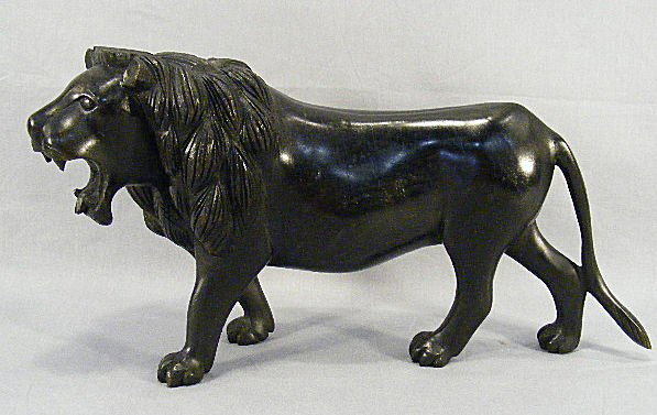 Carved wood lion, ebonized finish, folksy detail, e: Carved wood lion, ebonized finish, folksy detail, excellent condition, 18" long, 9.25" high