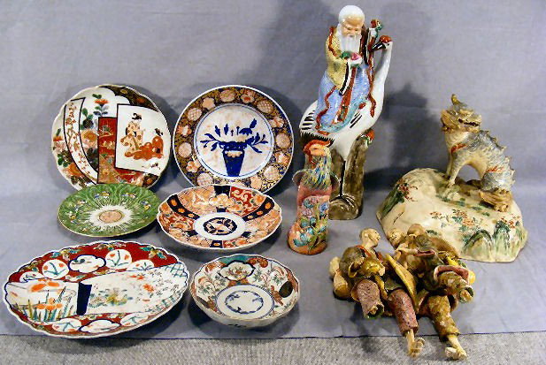 Lot of Chinese pottery, 15" figure of man on stork: Lot of Chinese pottery, 15" figure of man on stork, animal on mound with chip to horn and tips of spines on back, 10" high and wide, double figurine with two feet broken off & repair to basket, bird f