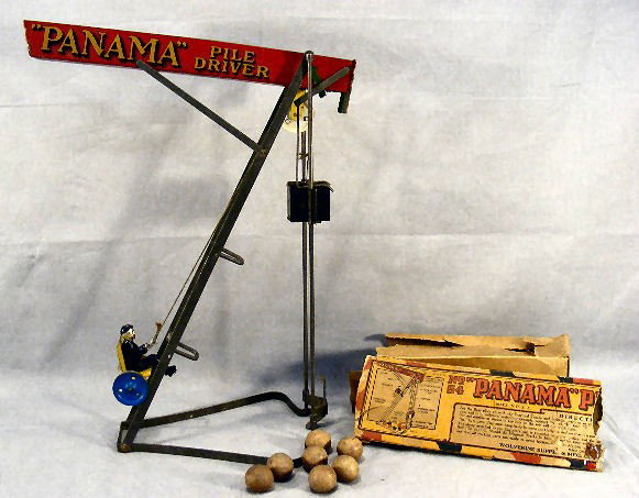 Tin toy Wolverine Panama Pile Driver, very good co: Tin toy Wolverine Panama Pile Driver, very good cosmetic condition, no over painting, 7 balls and partial box, 17" high, spacers for diagonal tracks separated from tracks on one side and need to be re