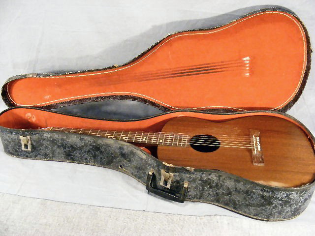 Acoustic guitar w/case, Goya made in Sweden, Seri: Acoustic guitar w/case, Goya made in Sweden, Serial #351671. Pick guard needs to be reglued. 38.75" tall
