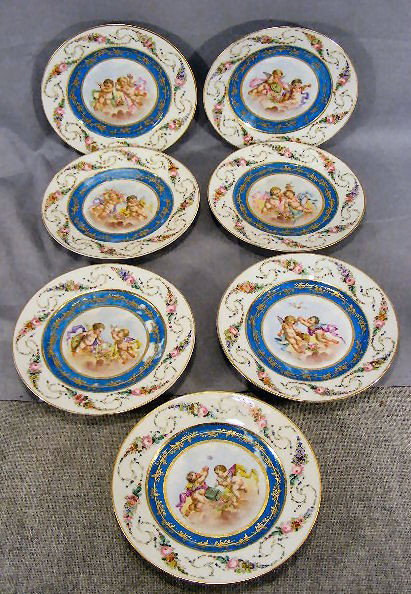 7 Chateau des Tuileries Sevres 8.5" plates, each : 7 Chateau des Tuileries Sevres 8.5" plates, each with hand painted cherub scenes and borders, no chips or cracks, some wear to blue inner ring from stacking