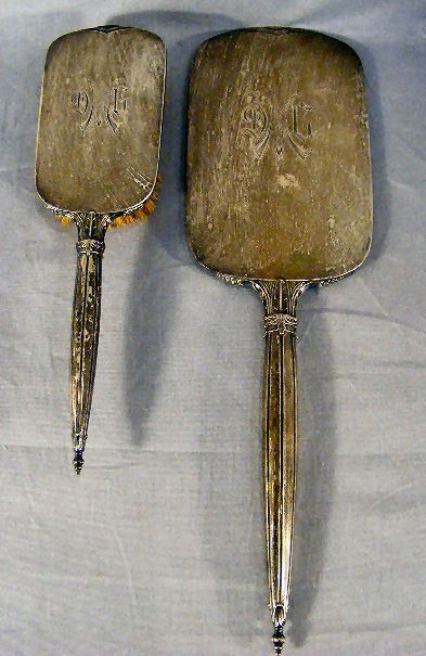 Vintage sterling hand mirror & brush. Some dings: Vintage sterling hand mirror & brush. Some dings & scratches, mirror discolored. Hand mirror is monogrammed and is 14.5" long x 4.25" wide.
