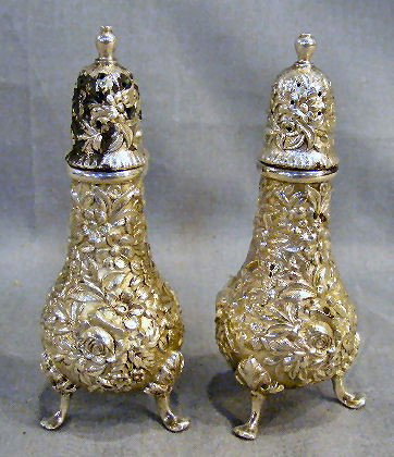 Kirk & Son sterling silver Repousse shakers: Kirk & Son sterling silver Repousse shakers, 4.5" high, 4.61 troy ounces total weight. Monogrammed on base.