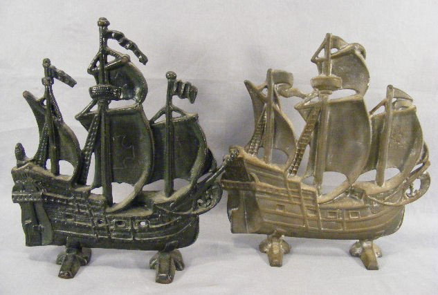 Two ship cast iron doorstops, one with black paint: Two ship cast iron doorstops, one with black paint, one unpainted