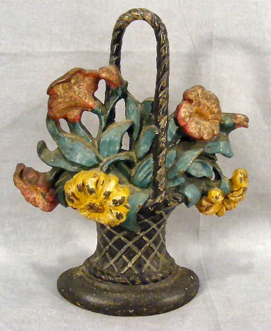Cast iron doorstop, flower basket, impressed 120 o: Cast iron doorstop, flower basket, impressed 120 on back, 9.75" high
