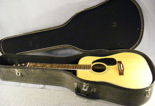 Atlas acoustic guitar w/ case. D-422 #33668. Abalo: Atlas acoustic guitar w/ case. D-422 #33668. Abalone inlaid neck & inlaid back, some scratches & scuffs, no cracks.
