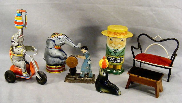 Lot of tin wind up toys including U.S. Zone German: Lot of tin wind up toys including U.S. Zone Germany elephant on motor bike, Lehmann Western Germany seal, early toy of man at sharpening stone each in working order. Chein elephant mechanical bank, Ap