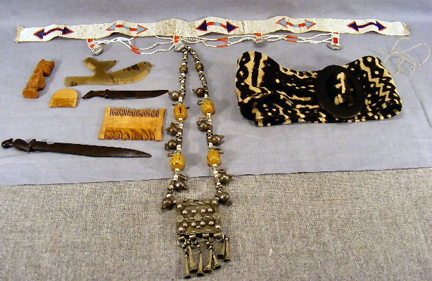 Lot of African cloth and beadwork belts, combs &: Lot of African cloth and beadwork belts, combs & letter openers and bead & metalwork necklace