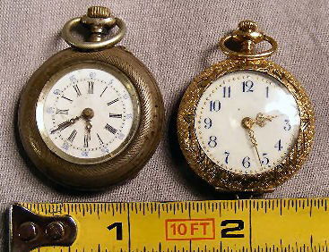 Two ladies watches, .800 silver with porcelain di: Two ladies watches, .800 silver with porcelain dial (lines) and gold filled watch with porcelain dial, neither running, shallow dents in cases