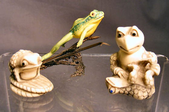 Two carved ivory Japanese netsuke, single toad an: Two carved ivory Japanese netsuke, single toad and toad with child and nodding head 1.5" high, signed. And Albany England bronze and porcelain figure of frog. From the estate of Rex Harrison and sold 