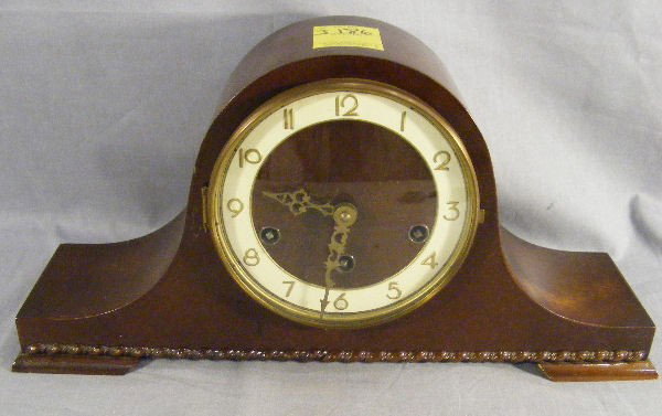 Mahogany mantel clock, made in Germany, chimes.: Mahogany mantel clock, made in Germany, chimes.