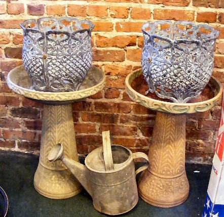 2 cement (?) bird baths (some chips), withering ca: 2 cement (?) bird baths (some chips), withering can, 2 planters & 20' telescoping flag pole (new in box), iron birdbath.