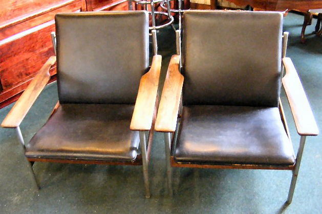 Pair Sven Dysthe / Dokka Mobler, made in Norway, r: Pair Sven Dysthe / Dokka Mobler, made in Norway, rosewood & metal. Wear to edges on leather, some corrosion on metal and finish is thin on arms. 28" wide, 29" deep x 30" high.