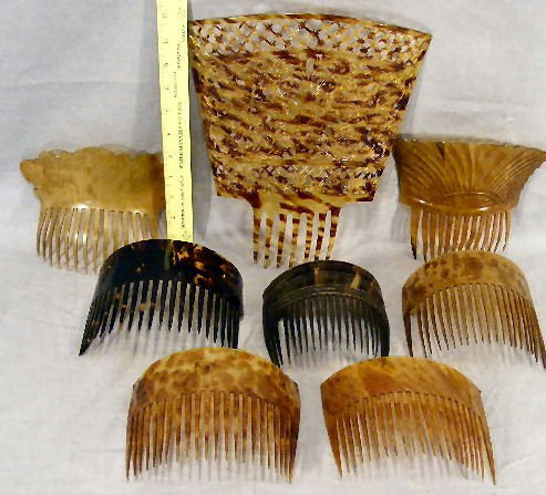 Lot of 8 hair combs, celluloid & tortoise shell, l: Lot of 8 hair combs, celluloid & tortoise shell, large comb in fine condition, others have some damage and large tortoise shell has missing end tooth.