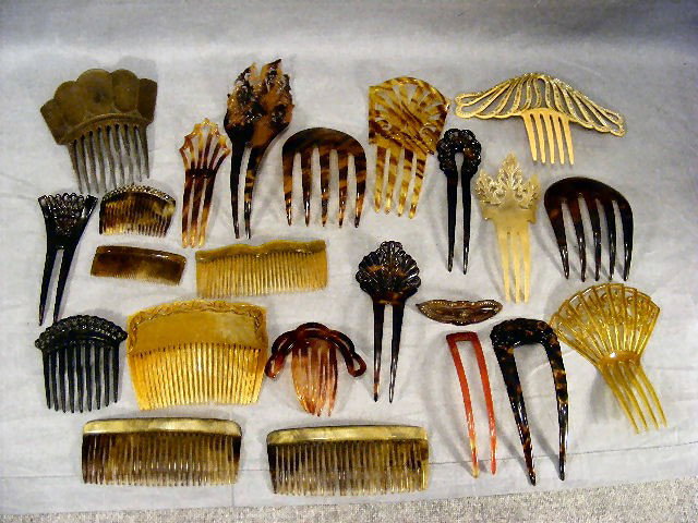 Lot of 23 celluloid, tortoise shell hair combs, on: Lot of 23 celluloid, tortoise shell hair combs, one has tip of one tooth chipped