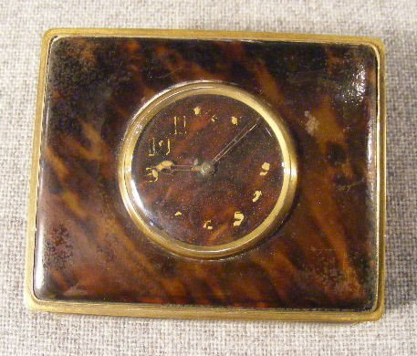 Antique tortoise shell desk box with clock on lid: Antique tortoise shell desk box with clock on lid, clock not working, numerals worn. Surface of box scuffed & dull, 4.5" X 3.5"