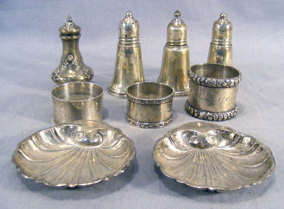 Lot of misc. sterling silver, three napkin rings,: Lot of misc. sterling silver, three napkin rings, two shell dishes, one salt and three weighted shakers, total weight of non weighted pieces is 5.62 troy oz.