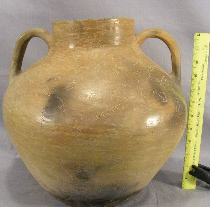 Large Native American handled pot, incised design: Large Native American handled pot, incised designs, one handle reattached, 13" high and wide