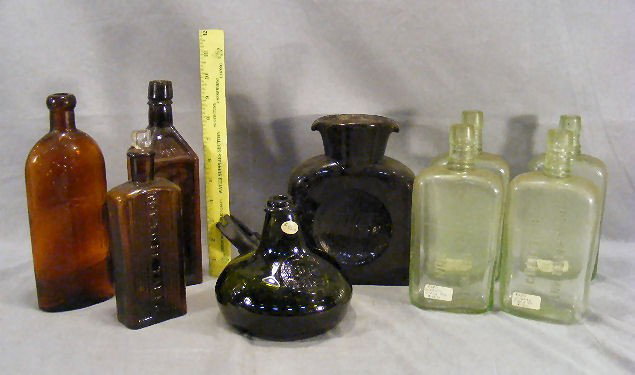 Lot of bottles, dark reddish brown 8" high, 6" wid: Lot of bottles, dark reddish brown 8" high, 6" wide with concave sides and double pouring lip, no cracks or chips, 4 Star & Carter Hotel bottles, Warner's Safe bottle with bruise, etc.