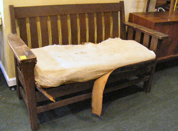 Mission style oak settee, finish damaged, needs u: Mission style oak settee, finish damaged, needs upholstery. 58.5" across x 35" tall.