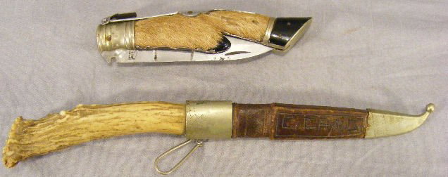 Stag handled knife with leather sheath, 9.25" ove: Stag handled knife with leather sheath, 9.25" overall length and folding knife with deer foot handle, blade locks in place and releases with lever, over all length 9.75" marked Albacete Indxiable