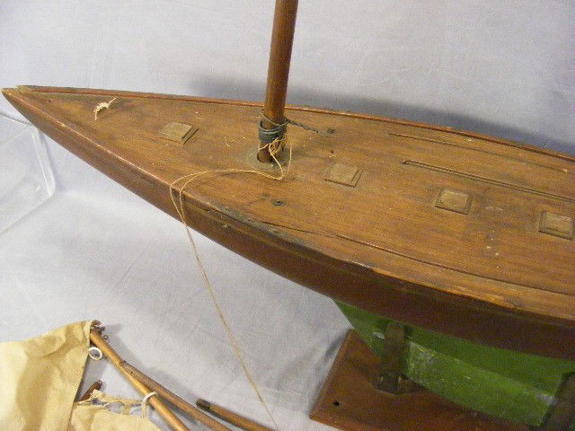 Antique pond boat with old paint and finish with n: Antique pond boat with old paint and finish with nice patina, sails fragile, original old stand, 36.5" long