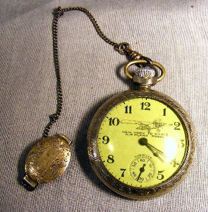Pocket watch & sterling chain: Charles Lindbergh: Pocket watch & sterling chain: Charles Lindbergh, New York to Paris Airplane Model. The E Ingraham Co. Bristol Ct. Sterling watch chain also included with pocket watch.
