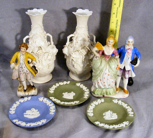 Porcelain lot, pair of Parian floral vases (damag: Porcelain lot, pair of Parian floral vases (damage to leaves & one is broken at top), 3 Wedgwood ashtrays and Japanese figures.