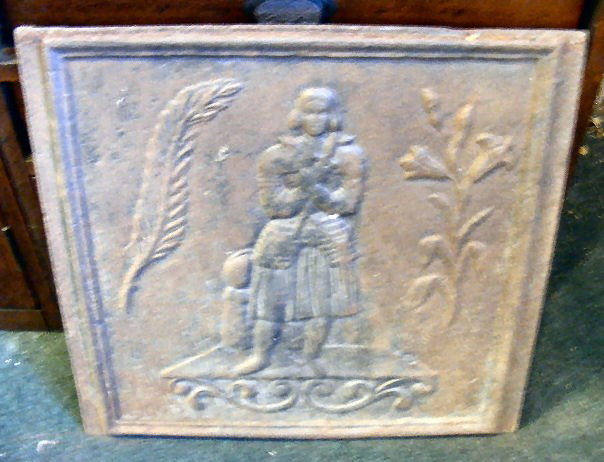 Cast iron fire back. Knight in center. 21.5" x 20: Cast iron fire back. Knight in center. 21.5" x 20.25" very heavy.