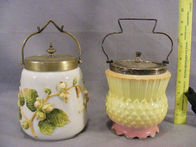 Two biscuit jars, one porcelain with relief decora: Two biscuit jars, one porcelain with relief decoration, and one ceramic figural thistle jar
