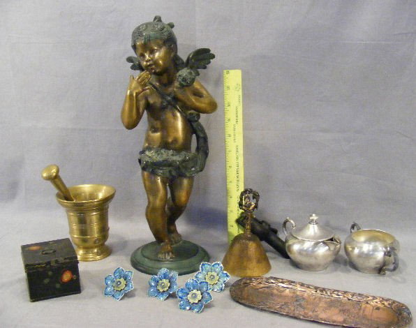 Patinated white metal cherub, brass mortar and pe: Patinated white metal cherub, brass mortar and pestle, bell, pin dish, silver plate, Tole box.