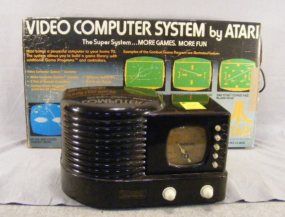 Crosley Limited edition radio and Atari model CX-: Crosley Limited edition radio and Atari model CX-2600 (Woody).