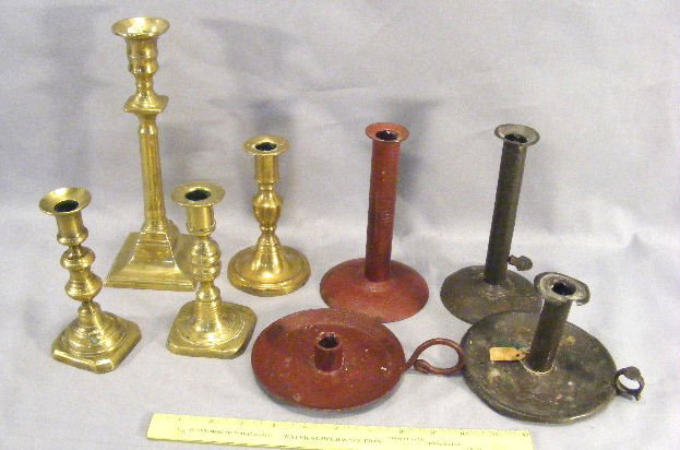 Lot of antique candle sticks, 2 hog scrappers, tin: Lot of antique candle sticks, 2 hog scrappers, tin & iron chamber stick, 4 brass candle sticks, etc.