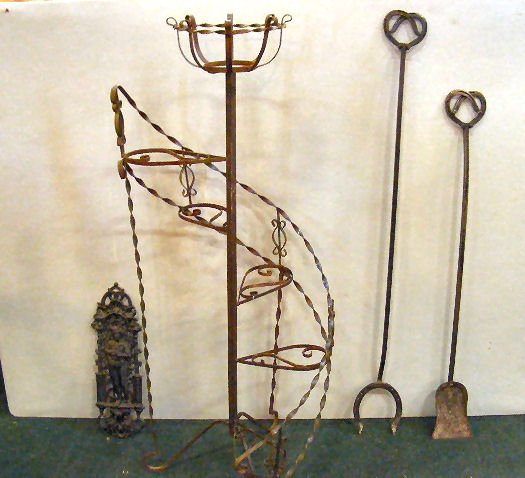 Misc. lot including wrought iron staircase plant : Misc. lot including wrought iron staircase plant stand 52" high, horseshoe motif fireplace tools and cast iron wall hanging.