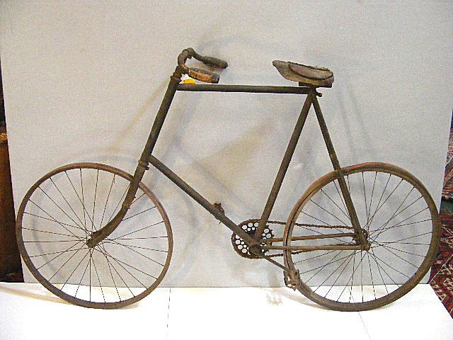 1890's Victor bicycle, Overman Wheel Company, woo: 1890's Victor bicycle, Overman Wheel Company, wood wheels with one old original tire, leather seat, cork grips, foot rests, 43" high to top of handle bars, 67" long.