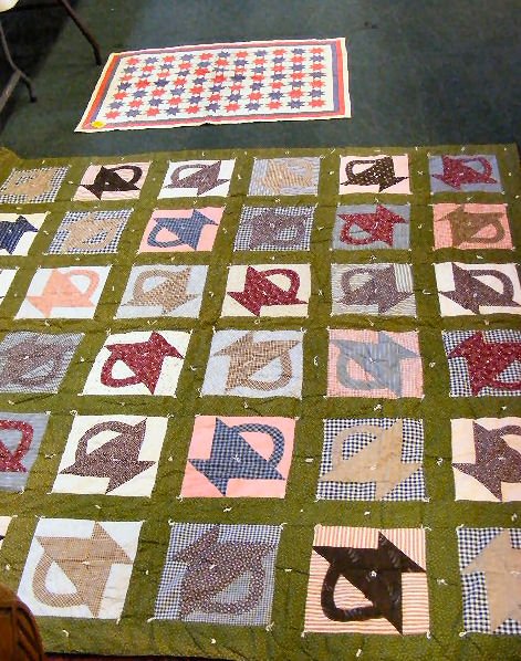 Two quilts, crib quilt 46" X 33" and basket quilt: Two quilts, crib quilt 46" X 33" and basket quilt 79" X 79" both in good condition, some staining on crib quilt