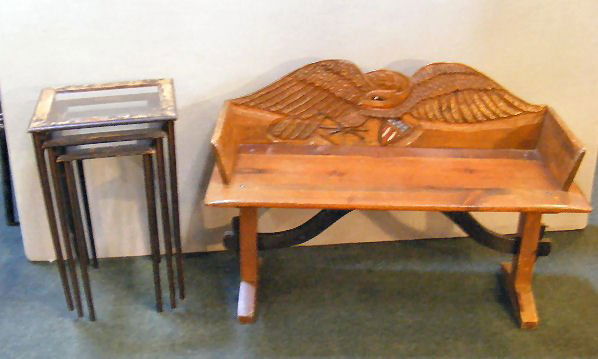 Carved pine bench with eagle back, 38" long and 2: Carved pine bench with eagle back, 38" long and 25" high together with nest of 3 tables with glass top, paint heavily worn.