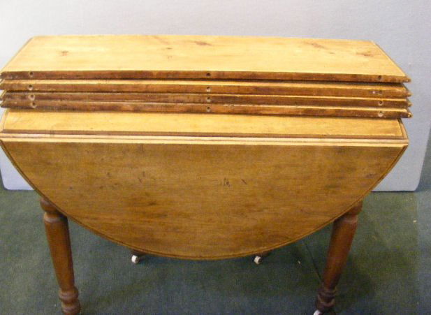 Antique drop leaf table, walnut, 4 leaves w/ 6 le: Antique drop leaf table, walnut, 4 leaves w/ 6 legs. Table measures 26" folded x 44" long x 29" tall. Drop leaves are 15" and the other leaves are 12" wide. Worn finish and the drop leaves are warped.