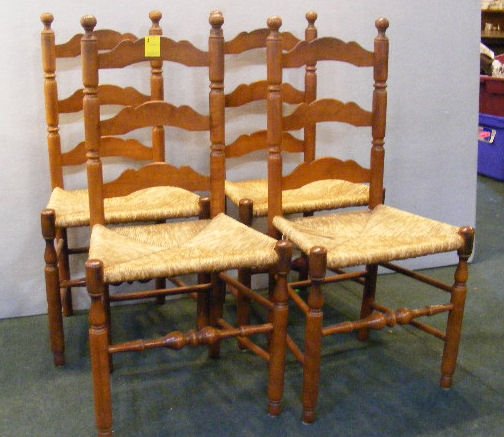 Set of 4 vintage ladder back chairs w/ rush seats: Set of 4 vintage ladder back chairs w/ rush seats. One seat is damaged.