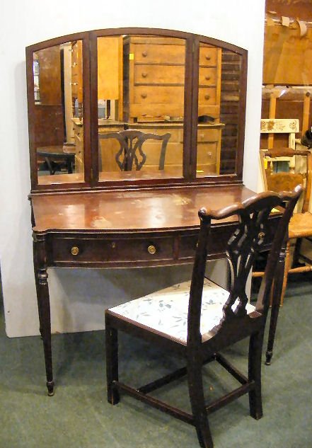 Nathan Margolis mahogany Sheraton style vanity w/: Nathan Margolis mahogany Sheraton style vanity w/ chair. Reeded legs, original pulls, original paper label dated 1918 in drawer, chair in not marked. Tri-fold mirror, vanity measures 43" x 21" x 60" t