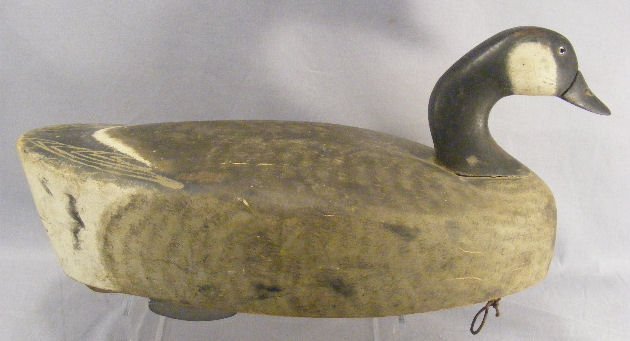 Carved Canada duck decoy, old original paint, one : Carved Canada duck decoy, old original paint, one glass eye missing, 21.75" long, from Hartford, Ct. estate.