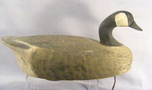 Carved Canada duck decoy, old original paint, 3" c: Carved Canada duck decoy, old original paint, 3" chip on tail, head loose on dowel, 21.5 " long, from Hartford, Ct. estate.