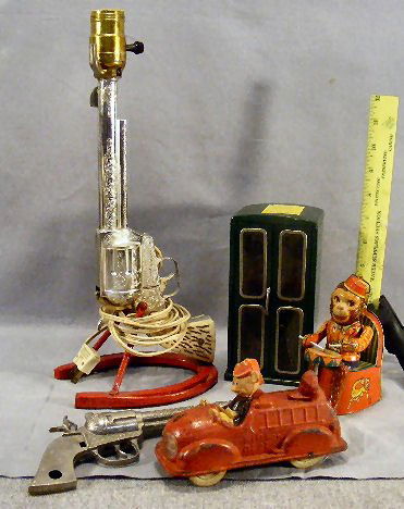 Lot including Mustang 500 toy pistol mounted as l: Lot including Mustang 500 toy pistol mounted as lamp, Sun Rubber Mickey Mouse fire truck, tin monkey San Japan, etc.