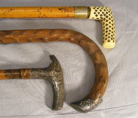 Lot of 3 canes/walking sticks, English sterling ha: Lot of 3 canes/walking sticks, English sterling handled cane (dented handle), cane with sterling handle cap and cane with handle of cast material (chip by shaft)
