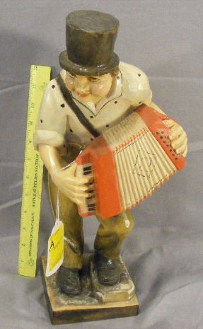 Large wood carving of man playing accordion, 15" h: Large wood carving of man playing accordion, 15" high, not marked