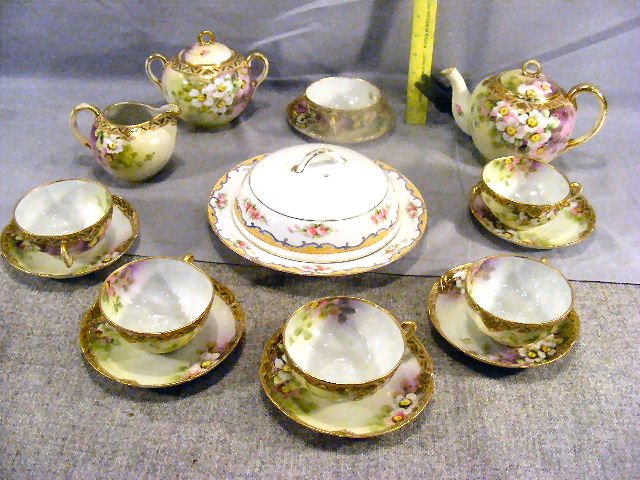Nippon tea set, six cups & saucers, creamer & sug: Nippon tea set, six cups & saucers, creamer & sugar bowl, teapot. Spout on teapot repaired, two saucers chipped. Together with Nippon covered dish