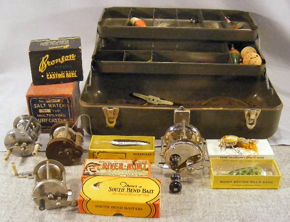 Fishing tackle, reels, lures & tackle box. Empty l: Fishing tackle, reels, lures & tackle box. Empty lure & reel boxes. 3 metal reels, Favorite #150, Liberty, South Bend #300 and a reel w/ plastic ends made in the USA.