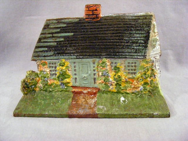 Vintage cast iron doorstop, cottage. 8.5" x 5.75" : Vintage cast iron doorstop, cottage. 8.5" x 5.75" tall.