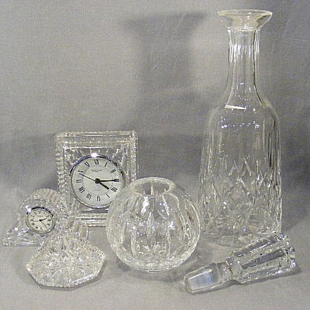 Waterford lot, decanter w/ stopper, 2 clocks, pape: Waterford lot, decanter w/ stopper, 2 clocks, paperweight and small bowl.