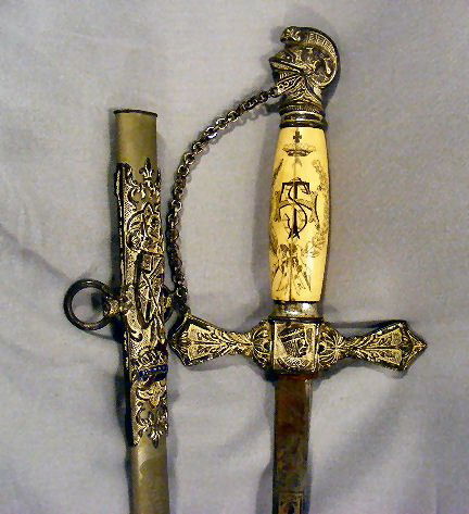 Fraternal Order sword by The Henderson Ames Co. Ka: Fraternal Order sword by The Henderson Ames Co. Kalamazoo Mich. Ivory handle (cracked), scrimshaw. On blade: etching, skull & cross bones, Memento-Hori, cross, knights, Samuel Button (also on scabbard